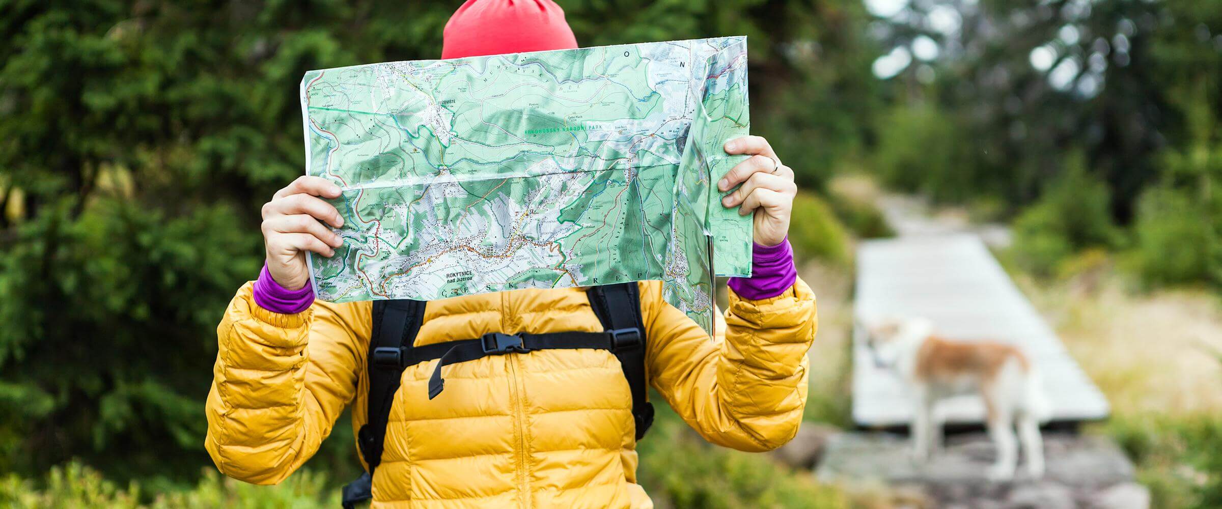 Explorer with Map and Dog